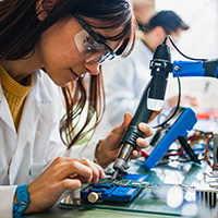 Close-up of person with tools in lab