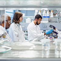 Three people in a lab