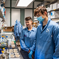 Two Students working in a lab.