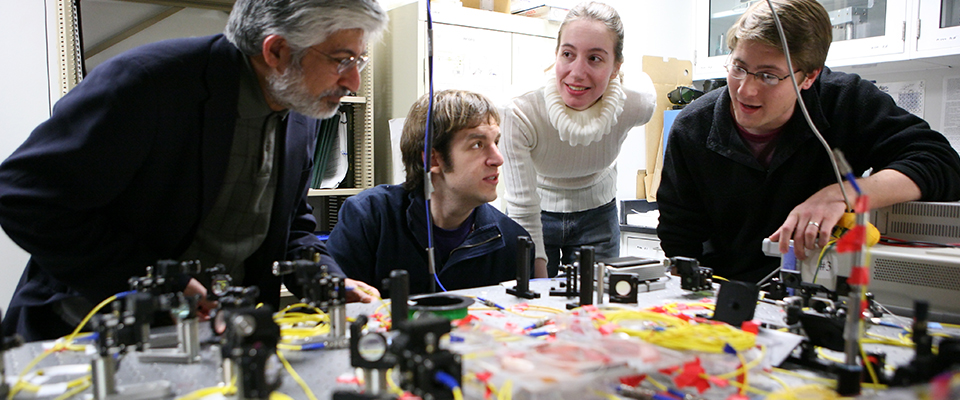 Prem Kumar and students working in lab on computer project