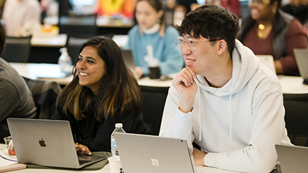 Two students in class setting.