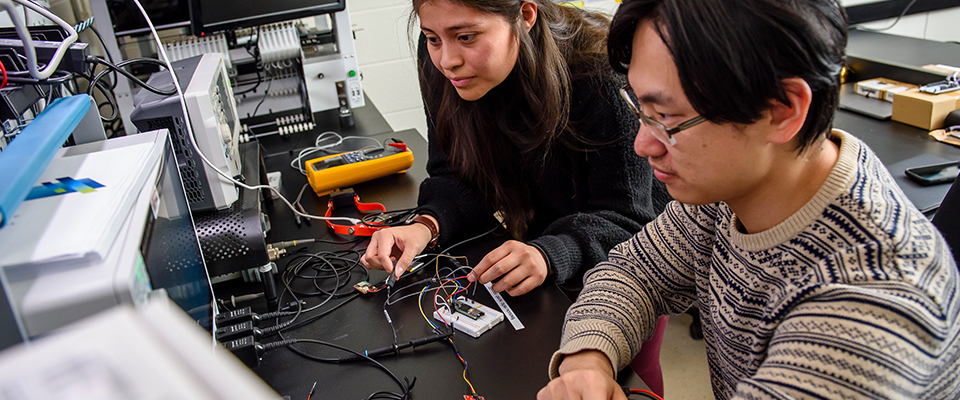 Students working on a computer.