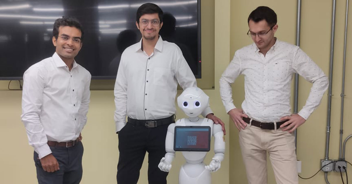 Three Northwestern Engineering students, including two from MEM, with Pepper, the world’s first social humanoid robot.