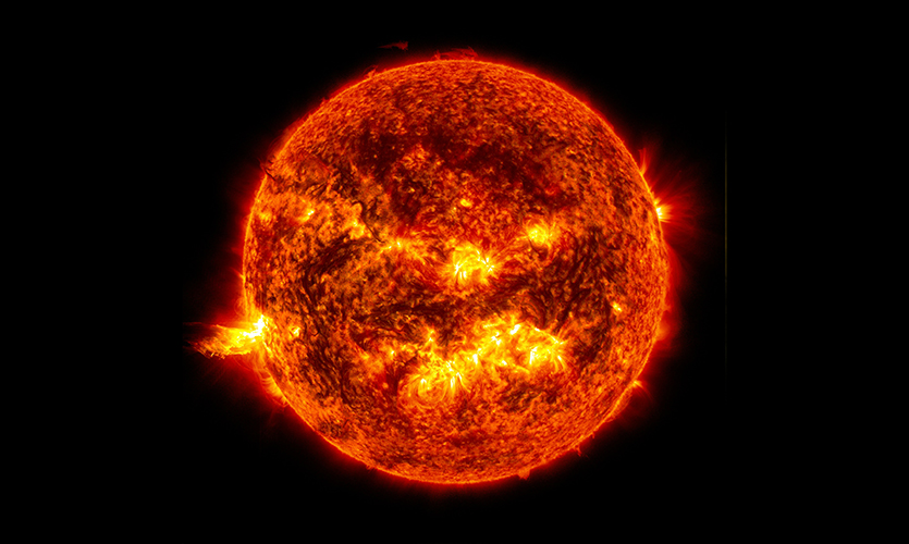 This image shows the bright light of a solar flare on the left side of the sun and an eruption of solar material shooting through the sun’s atmosphere, called a prominence eruption. Photo: NASA/Goddard/SDO