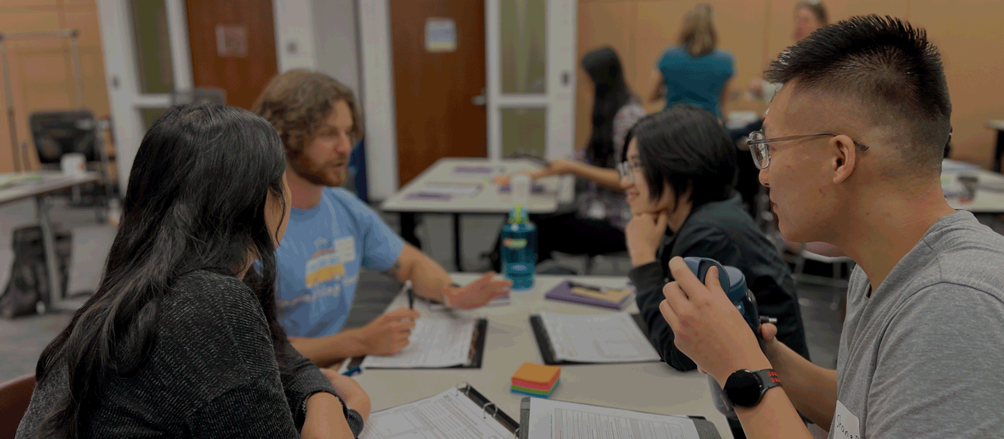 Students talking at tables