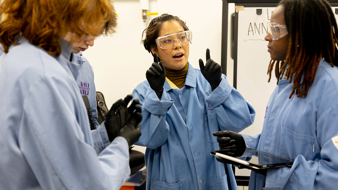 PhD student Kayna Mendoza Trujillo (center) prepares students before a battery fabrication lab. The students, from left, are undergraduates Joaquin Noguera, Ben Sheward, and Wen-Yam ZONGO.  